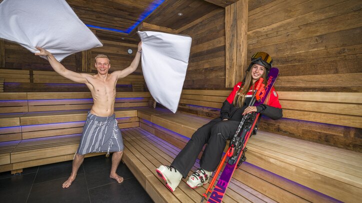 Aufgussmaster with Skier in Sauna